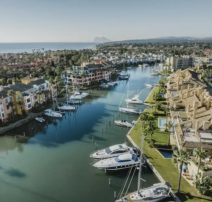 Apartments lining the marina canal with Gibraltar beyond