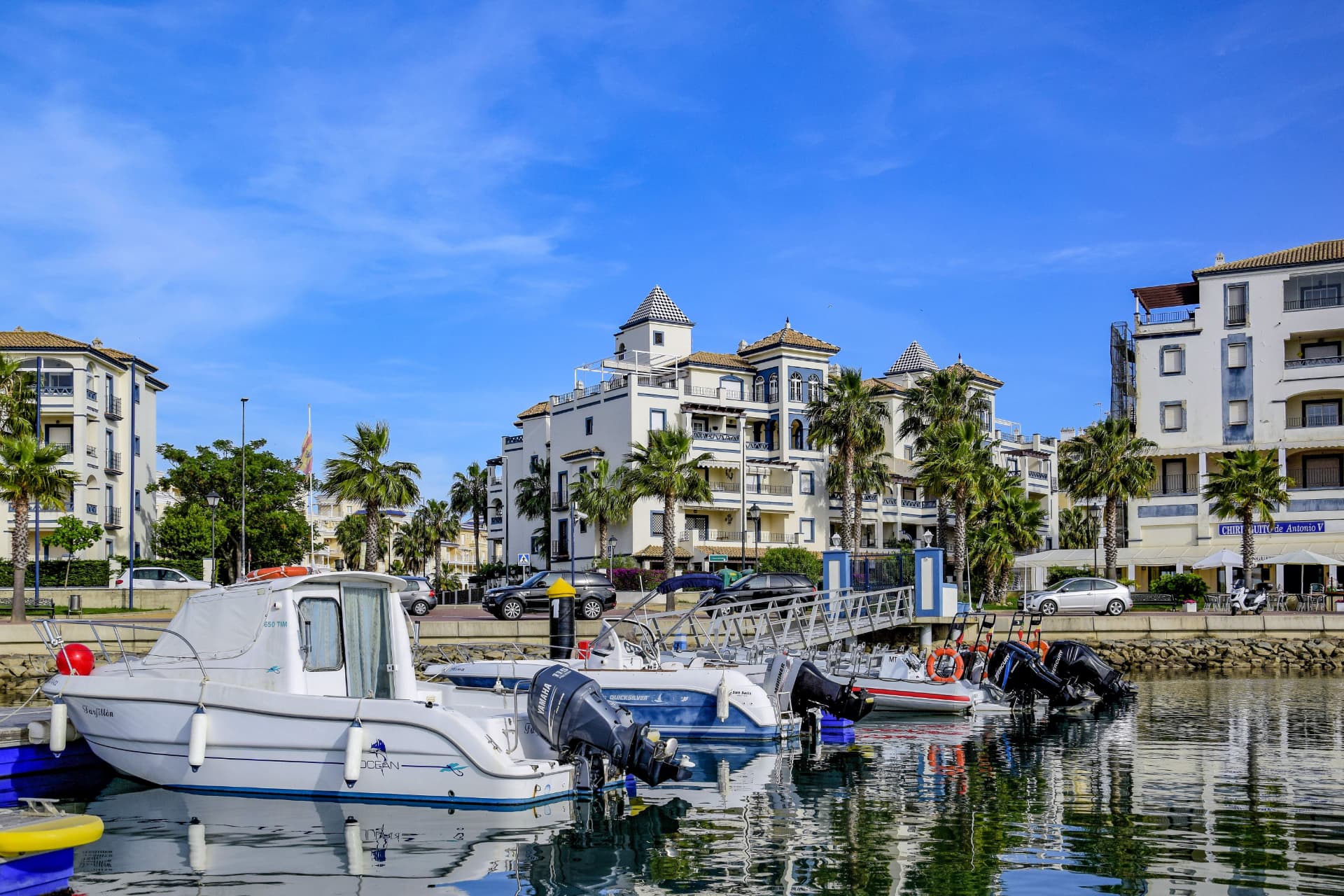 Sotogrande Marina, boats moored in front of the apartments and palms