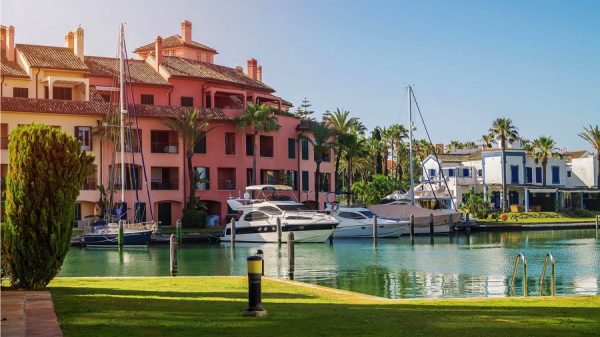 Pink and yellow apartments on the marina canal